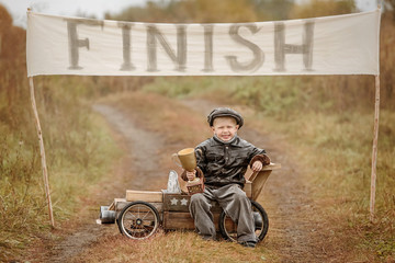 Portrait of a boy-racer with the cup from his car