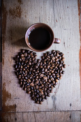 coffee beans arranged in the shape of a heart