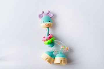giraffe toy. Clockwork plastic toy isolated on white background.