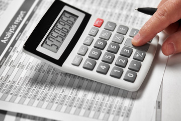 Businessman working and calculating finance. Business financial accounting concept. Closeup hands.