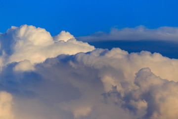 Clouds after rain before sunset as a background