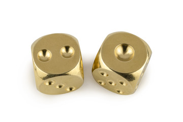 Two golden dices closeup isolated on white background. Two and one, with a shadow.