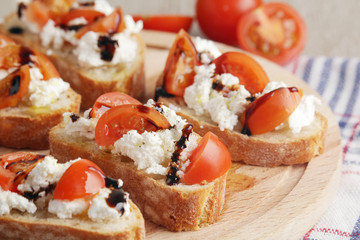 Sandwiches with tomatoes, homemade cheese, olive oil and balsamic sauce