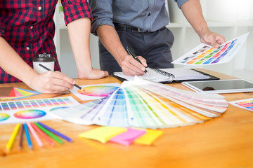 team Web designer working drawing something on graphic computer in the office or studio.