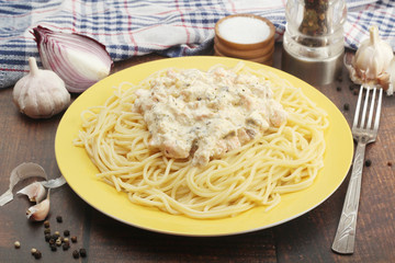 A plate with pasta with salmon