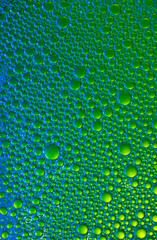 Abstract background of different colors with round drops.