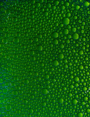 Abstract background of different colors with round drops.