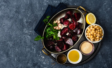 Ingredients for cooking healthy vegetarian beet hummus copy space top view
