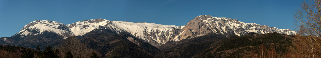 Panoramic view on the snow covered Peaks of Schneeberg and Rax in Spring, Austria