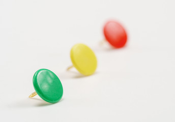 Collection of colorful office pins, on white background. Bright colors in dull working gray days.