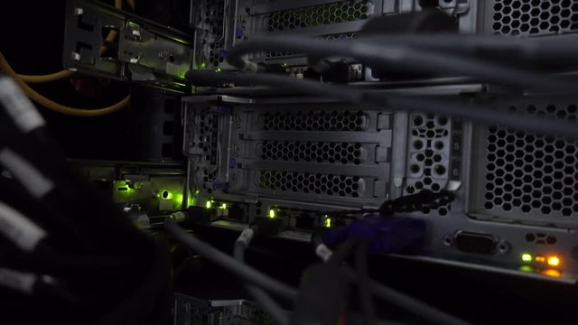 Back panel of powerful servers installed in the rack of the server room of the data center