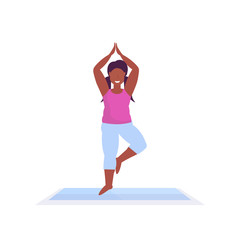 sporty woman doing yoga exercises african american girl meditating standing in tree position working out fitness healthy lifestyle concept female character full length white background