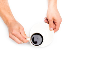 men's hands holding a white cup of coffee on white isolated background, place for text