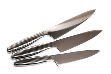 Set of steel kitchen knives on white background