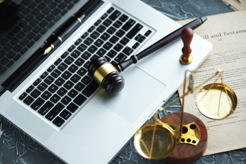 Judge gavel and legal book on wooden table, justice and law concept