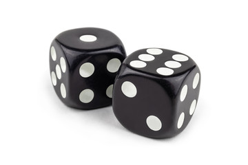 Two black dice isolated on a white background. One and six are so close.