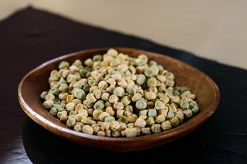 microgreen peas grain and germinated sprout on a light background