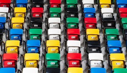 Fototapeta premium Rows of an empty colourful plastic seats