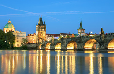 Fototapeta na wymiar Scenic view Charles bridge and historical center of Prague, buildings and landmarks of old town at sunset, Prague, Czech Republic
