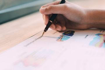 Close-up Of Businesswoman Analyzing Graph in the office - Image