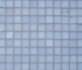 Square gray glass slabs cladding on wall