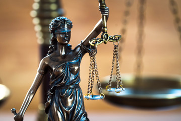 Law and Justice concept on wooden background