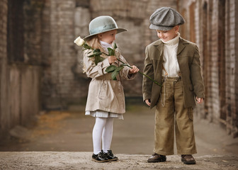 Romantic meeting of two children in the old town