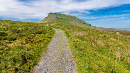 Yorkshire Dales landscape on the Pennine Way between Halton Gill and Horton in Ribblesdale with the Pen-Y-Ghent in the background, North Yorkshire, England, UK