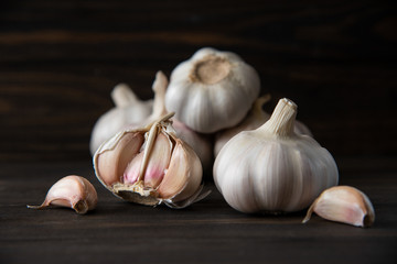 Garlic bulb on the wooden vintage background