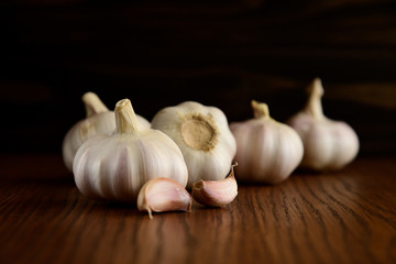 Garlic bulb on the wooden vintage background