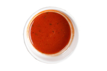 Chili sauce in a bowl on white background. One of the collection of various sauces.