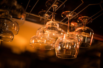 Hanging wine glasses in a pub