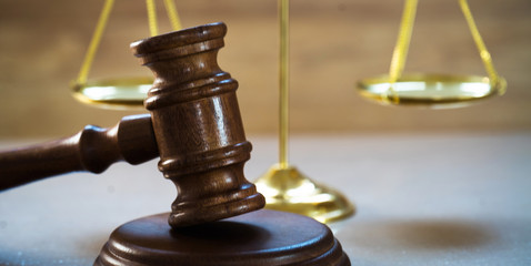 Law and Justice concept on wooden background