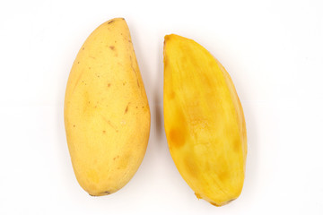 ripe mangoes, yellow mango isolated on black background.