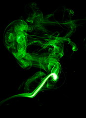 Green smoke on black background