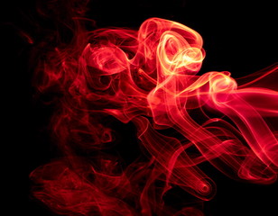 Red smoke on black background