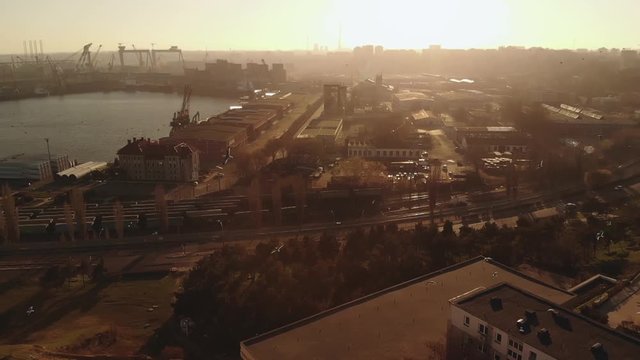Pan aerial shot of Old Town Constanta City and harbor, Romania, Europe. Shot in spring during sunset and Golden Hour, revealing the Black Sea, harbor and architecture while seagulls fly