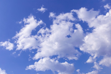 Naklejka na ściany i meble Blue sky background with white clouds, rain clouds on sunny summer or spring day.