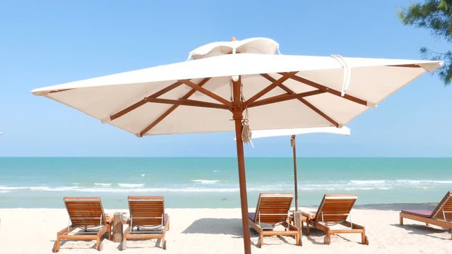 Beach chairs and canopy on the tropical beach. Nature at its best vacation concept.