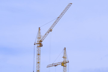 Fototapeta na wymiar construction cranes construction of houses