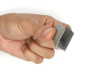 male hand holding Metal staples for stapler isolated on white background