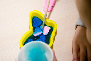 Process of homemade soap, mixing lye solution into oil. Making a gift with your own hands.
