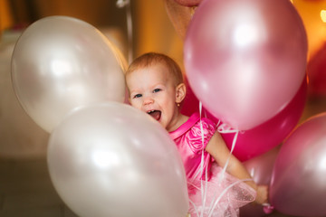 Funny joyful girl with pink balloons, childhood