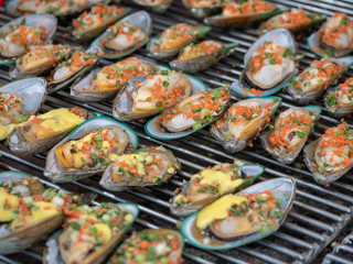 Grilled New Zealand mussels baked with saucs