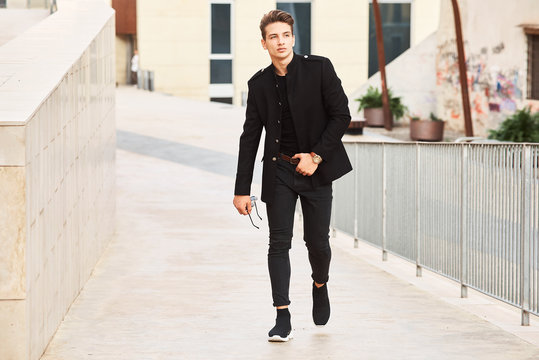 Young handsome man wearing black clothes