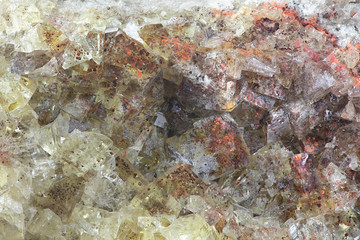 Fototapeta na wymiar Crystals of fluorite with hematite inclusions from Illo calcite quarry in Finland