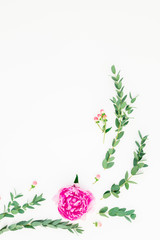 Floral frame with pink peonies and roses flowers and eucalyptus on white background. Flat lay