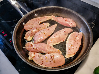 STOCKHOLM, SWEDEN Chicken frying in pan