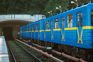 open-type Dnipro station and subway train approaching to the platform for passenger landing