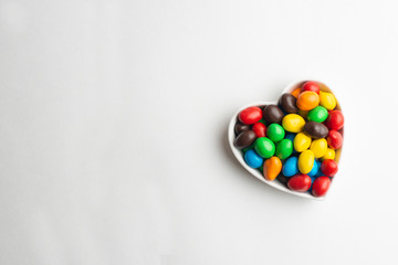 Coated chocolate candies shaped into a heart
